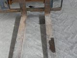 a fork lifter that is sitting on the ground