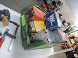 a pile of boxes and tools on a table