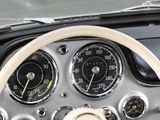 a steering wheel and dashboard of a vintage car
