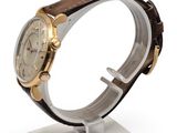 an image of a close up of a wrist watch on a stand