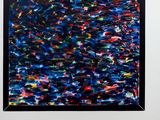 an abstract painting of blue, red, and black paint on a white wall