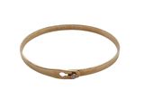 a close up of a gold bracelet on a white background