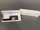 the watch is in the box with the box open