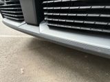 a close up view of a car ' s grille and front bumper