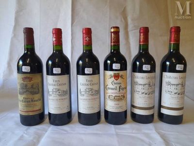 six bottles of wine are lined up in a row on a table