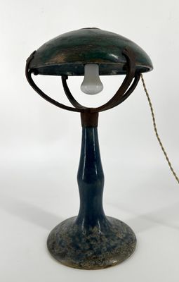 an image of a lamp that is on a table with a chain