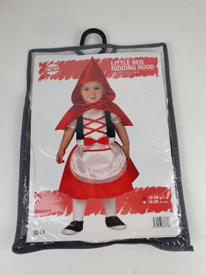 a little girl dressed in a little red riding hood