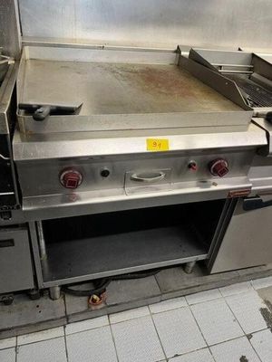an image of a commercial kitchen with stainless steel appliances
