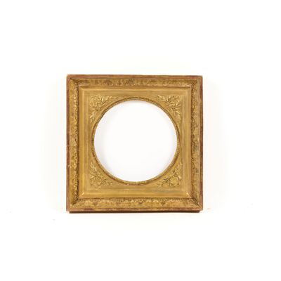 an antique gold frame with a white background