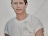 a young man in a white shirt posing for a picture