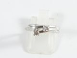 sterling silver ring with brown diamonds on a white background