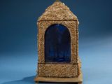 a small blue glass window in the middle of a wooden stand