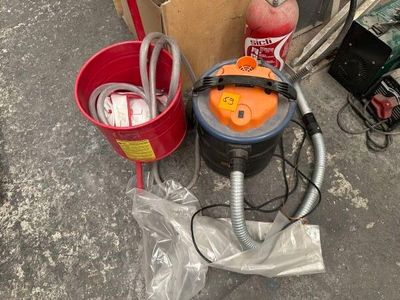 an image of a bucket and a vacuum on the ground