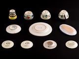 a lot of small plates and cups on the table