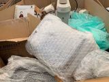 a cardboard box filled with lots of items in it