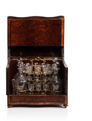 a wooden cabinet with many glasses in it