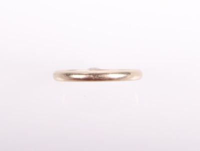 a close up of a gold ring on a white background