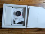a box with a camera inside of it on a table
