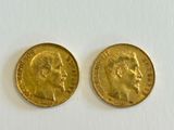 two gold sovereigns, one of which has a head of a man and the other of a woman