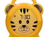 yellow alarm clock with a tiger face on the face