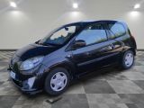 a picture of a small black car on a checkered floor