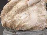 marble statue of a woman holding a baby in her arms