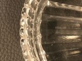 a clear glass container with a hole in it