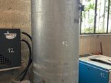 a large metal tank sitting in the middle of a room