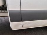 a white van with a black stripe on the side of it