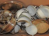 a box full of dishes and pans in it