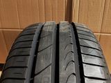a close up of a tire on a cardboard box with a cardboard box in the background
