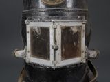 a close up of a black and white fire hydrant with a clock on it
