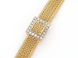 an 18k yellow gold mesh bracelet with a diamond clasp