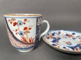 an image of a cup and saucer sitting on a table