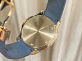 a person holding a watch in their hand