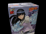 figurine d'anime représentant Naruto dans une boîte, sur fond noir