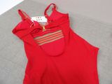 red tank top with gold trimmings on the shoulders