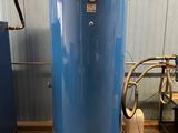a large blue tank sitting in the middle of a room