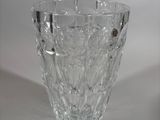 a glass vase that is sitting on a table