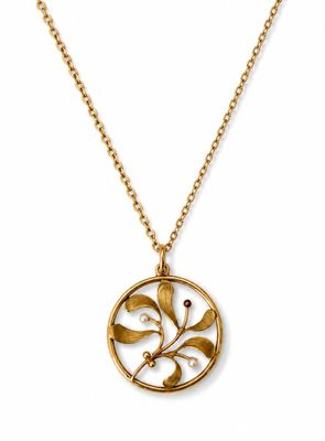 a gold plated necklace with a circular pendant with leaves and pearls
