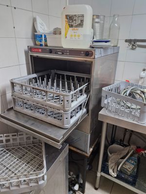 a kitchen with a bunch of dishes in the dishwasher