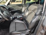 the interior of a car with a steering wheel and seat covers