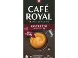 une boîte de café « Café Royal » accompagnée d'une tasse de café