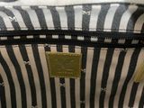 an image of a black and white striped purse