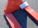 a red piece of equipment that is laying on the ground