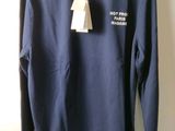 navy long sleeved polo shirt with white collar and white trim