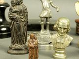 many figurines of different sizes and shapes on the table