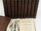 several old books sitting on top of each other on a table