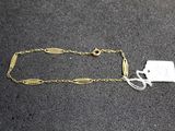 a close up of a chain with a tag attached to it