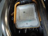 a yellow light that is sitting in the back of a car